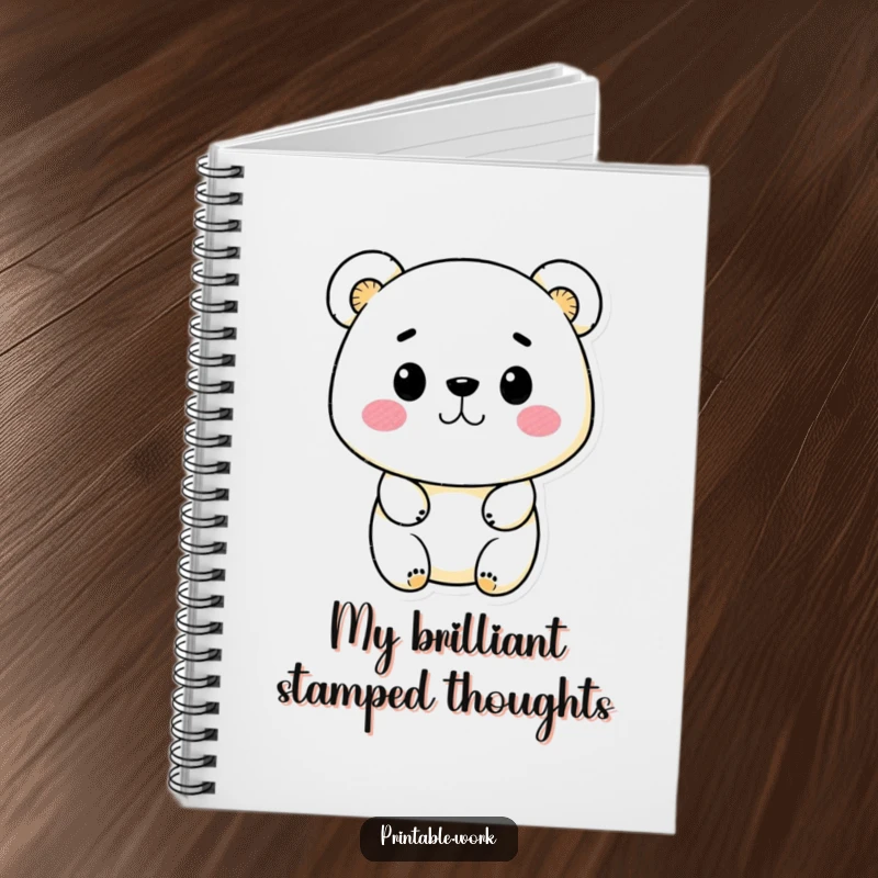Funny Kawaii bear character using ink stamps on a notebook cover, encouraging creative writing and design planning.