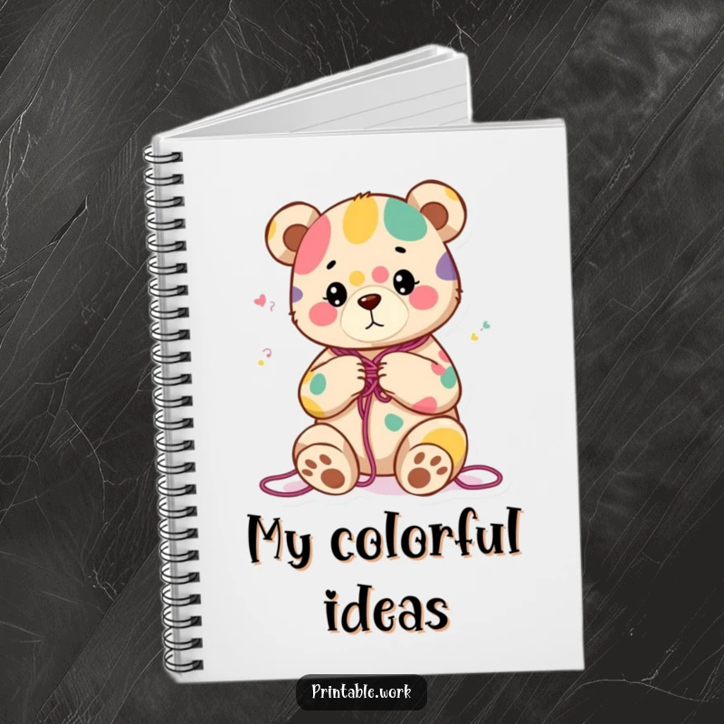 Funny notebook cover with a content bear character knitting a colorful abstract pattern, ideal for planning creative projects and jotting notes.